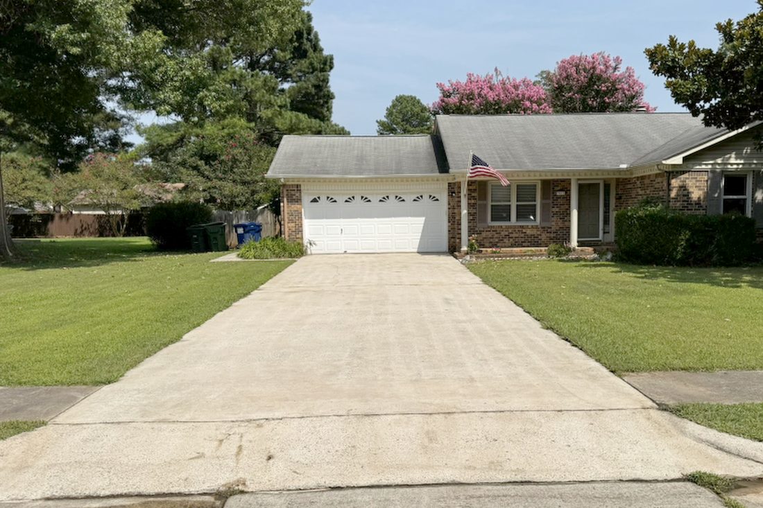 The same driveway after pressure washing